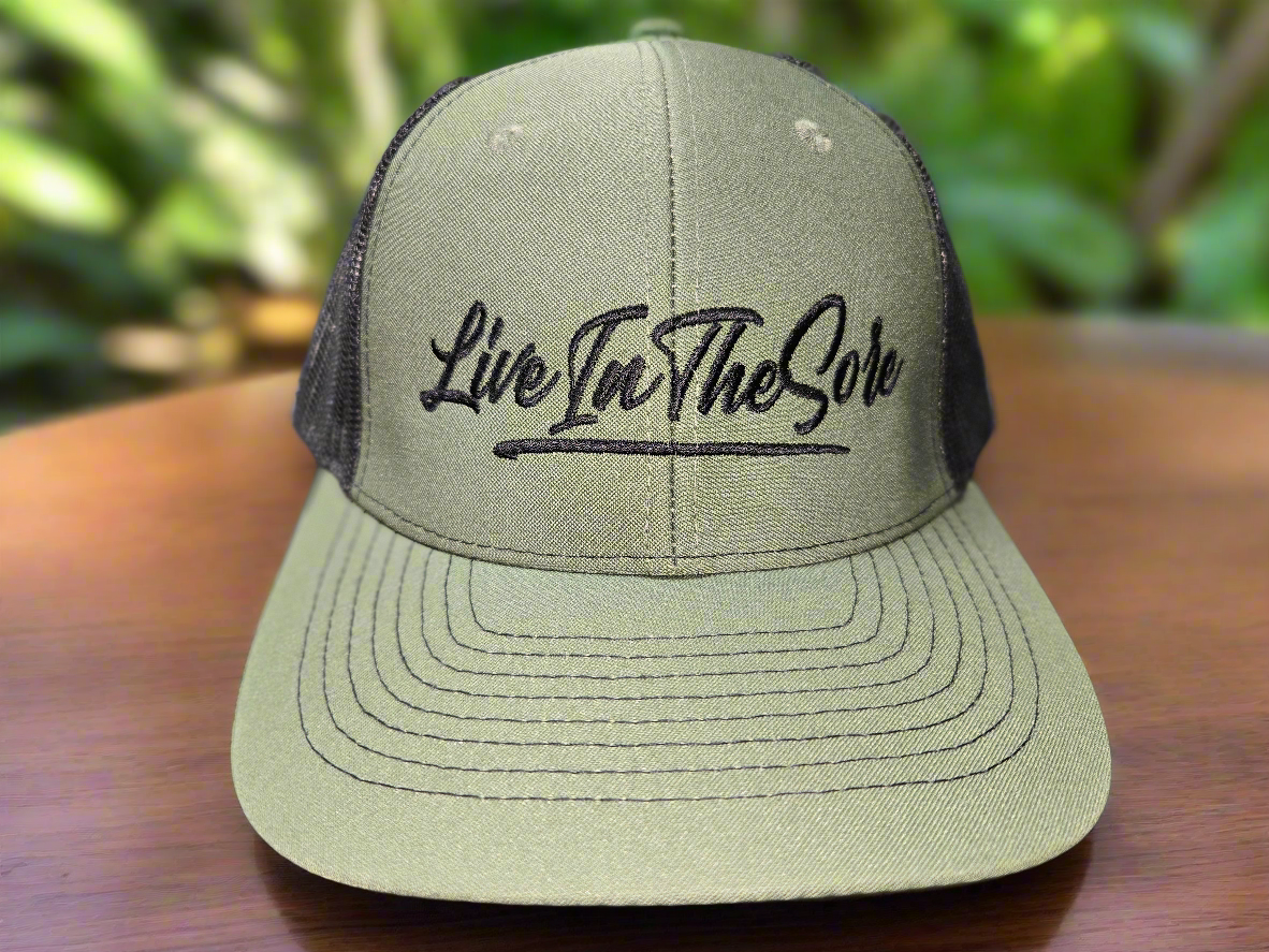 LIVEINTHESORE Trucker Hat