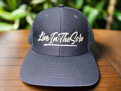 LIVEINTHESORE Trucker Hat