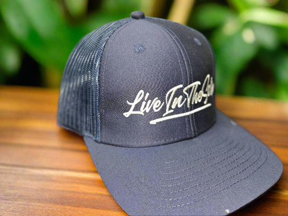 LIVEINTHESORE Trucker Hat