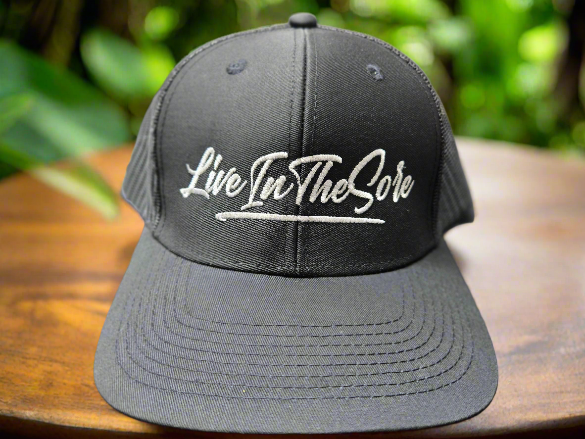 LIVEINTHESORE Trucker Hat